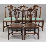 A selection of nine George III provincial oak dining chairs, comprising a set of four solid seat