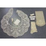 A small group of lace items, including a Brussels collar, two headpieces, edging and a large black