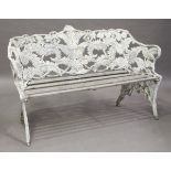 A suite of 20th century Coalbrookdale style fern pattern cast metal garden furniture, comprising a