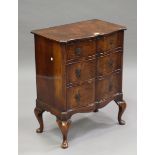 An early 20th century Queen Anne style walnut serpentine-fronted chest of three drawers, on cabriole