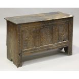 A late 17th/early 18th century oak and elm panelled and boarded coffer, the front later carved