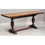 A George V Jacobean Revival oak refectory table, raised on cup and cover supports, height 76cm,