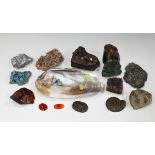 A small group of mineral specimens, including dessert rose, amethyst and quartz, together with an