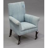 An early 20th century child's armchair, raised on cabriole legs and castors, height 71cm, width