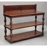 A late Victorian walnut three-tier serving buffet, the panelled gallery back above turned