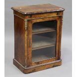 A mid-Victorian burr walnut and boxwood inlaid music cabinet with gilt metal mounts, the glazed door