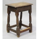 A late 17th century oak joint stool, the moulded seat on turned and block legs, height 56.5cm, width