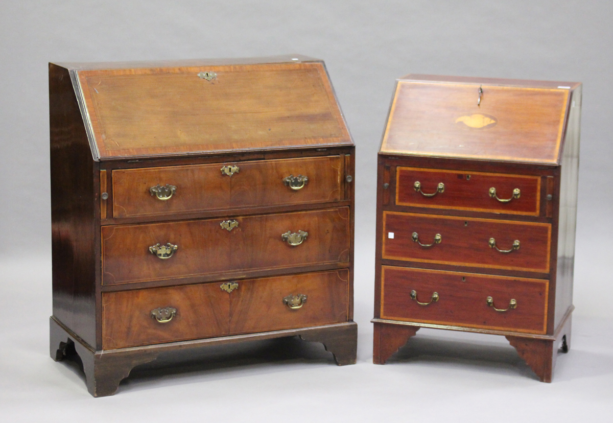 An Edwardian mahogany bureau, crossbanded in satinwood and with shell patera inlay, the fall flap