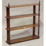 A Victorian mahogany four-tier hanging wall shelf, height 84cm, width 74cm, depth 16cm.Buyer’s