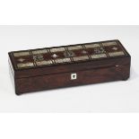 A Victorian rosewood and mother-of-pearl inlaid games box, the lid with a cribbage board,