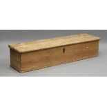 A late 19th century long pine trunk, the hinged lid enclosing a compartmentalized interior, height