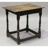A mid/late 17th century oak table, the rectangular top on turned and block legs, height 69cm,