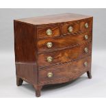 A George III figured mahogany bowfront chest of three short and three long drawers, on outswept