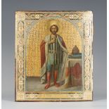 A late 19th/early 20th century Russian painted and gilded fruitwood icon, depicting Alexander