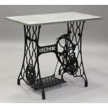 A 19th century and later marble-topped garden table with a cast iron Singer treadle sewing machine
