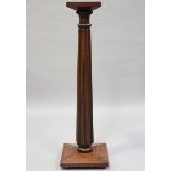 A Victorian mahogany jardinière stand with reeded column, height 135cm.Buyer’s Premium 29.4% (