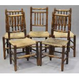 A harlequin set of five provincial ash spindle back rush seated chairs, height 100cm, width 48cm.