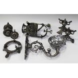 A group of mainly 19th century polished steel items, including two door knobs, a pair of fire tool