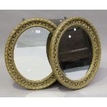 A pair of early 20th century giltwood oval wall mirrors, 65cm x 55cm.Buyer’s Premium 29.4% (