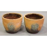 A pair of late 20th century terracotta plant pots with relief decorated Chinese symbols, height