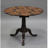 A George III mahogany tip-top supper table, the circular top later carved with nine roundels and