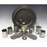 A small collection of pewter items, including an 18th century charger, diameter 42cm, a group of