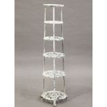 An early 20th century white painted cast metal six-tier pan rack, raised on claw feet, height