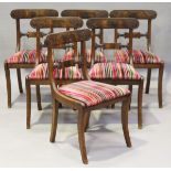 A set of six Regency mahogany bar back dining chairs with finely carved decoration and striped