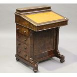A mid-Victorian burr walnut Davenport by Thomas Turner of Manchester, the hinged writing surface