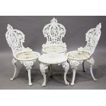 A set of three Victorian white painted cast iron garden chairs with pierced foliate backs and