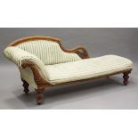 A late Victorian walnut showframe chaise-longue, on turned legs, height 77cm, length 185cm, depth