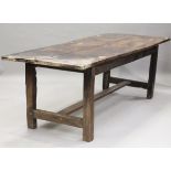 A 17th century and later elm and oak refectory table, the elm two-plank top with cleated ends,