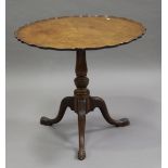 An early 20th century George III style mahogany tip-top wine table, the piecrust top above a