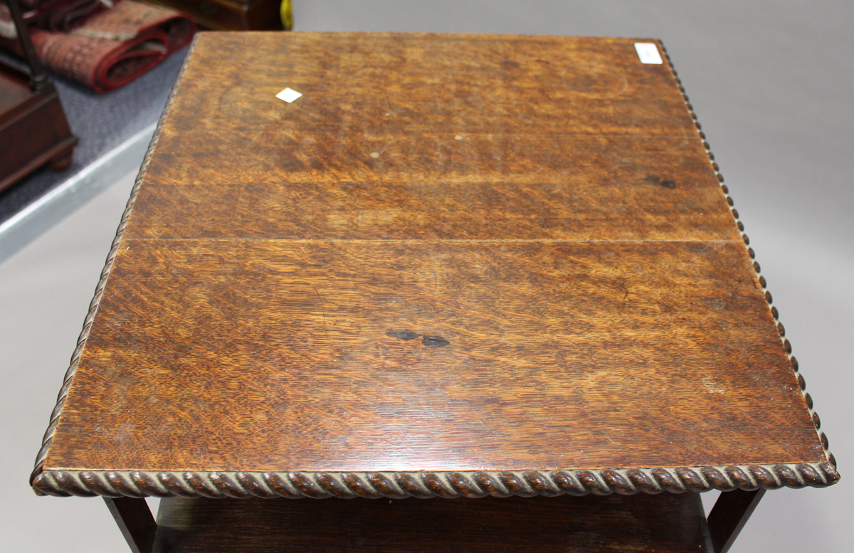 A George V oak revolving bookcase with a gadrooned edge and slatted sides, height 106cm, width - Image 3 of 3