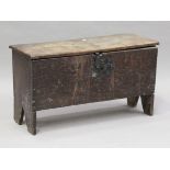 A small 17th century six-plank boarded coffer, the hinged lid and front with wrought iron lock,