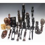 A group of mainly late 20th century African hardwood carvings, mostly figural.Buyer’s Premium 29.