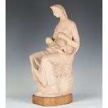 Attributed to Charles Thomas Wheeler - a terracotta figure group of a seated mother and child, the