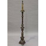 A 19th century Baroque Revival giltwood and gesso candle stand, later converted to electricity and