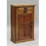 An early 20th century oak side cabinet, fitted with two drawers above a panelled cupboard, height