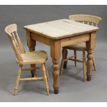 A 20th century pine two-seater kitchen table, height 77.5cm, width 76cm, depth 75cm, together with a