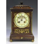 A 19th century brass inlaid rosewood mantel clock with French brass eight day movement striking on a