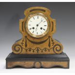 A late 19th century burr walnut and ebonized mantel clock with eight day movement striking on a