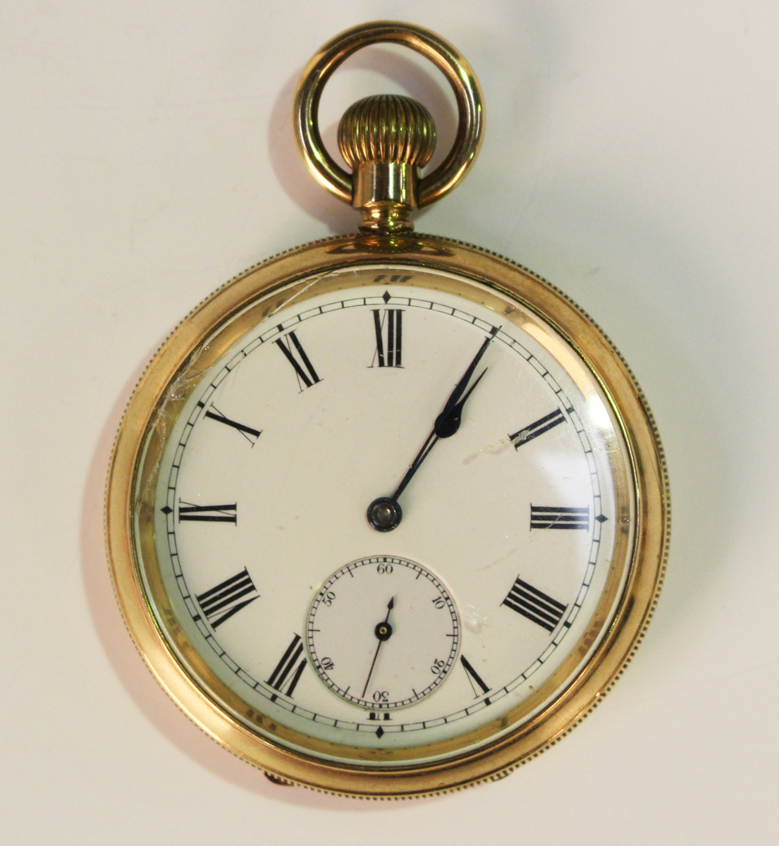 An Omega gilt metal cased keyless wind open-faced pocket watch, the signed jewelled lever movement