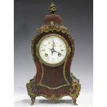 A late 19th century French tortoiseshell and gilt metal mounted mantel clock with eight day movement