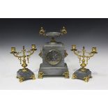 A late 19th century French gilt brass and grey marble mantel clock garniture, the clock with eight