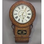 A late Victorian inlaid walnut drop dial wall clock with eight day movement striking on a gong,