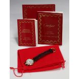 A Cartier Vendôme Quartz 18ct gold circular cased lady's wristwatch, the signed dial with black