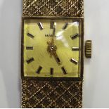 A Marvin 9ct gold lady's bracelet wristwatch, the square signed dial with batch hour markers, case