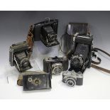 An Ebner Bakelite cased camera with Trioplan 1:4.5 F=7.5mm lens, a Zeiss Ikon Nettar 515/2 folding