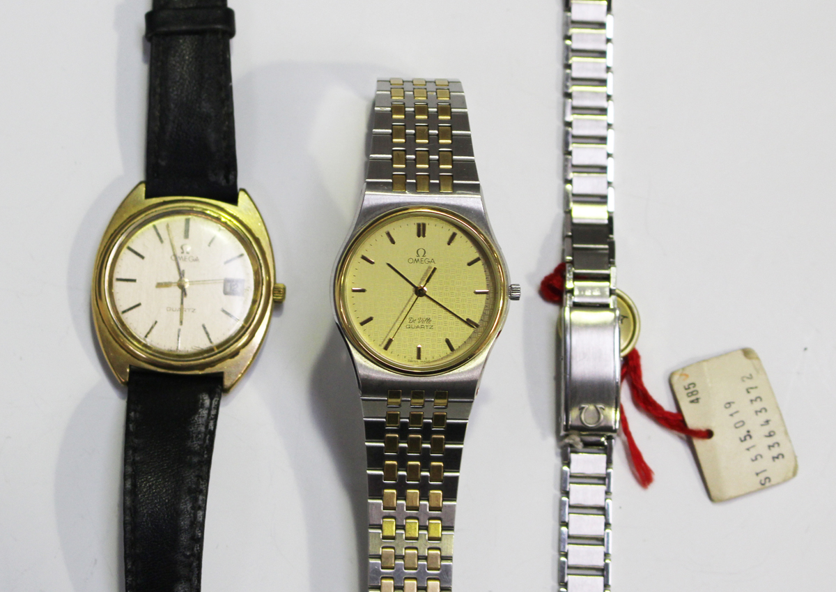 An Omega Quartz gilt metal fronted and steel backed gentleman's wristwatch, the signed dial with